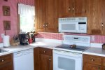 Fully equipped kitchen with gorgeous restored cabinets, stove/oven, refrigerator and dishwasher 